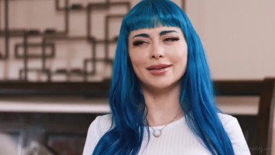 Destiny Mira & Jewelz Blu on a grey bed in lesbian and lesbian dildo scenes together