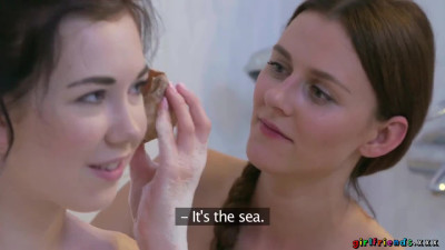 Daphne Angel and Kira Zen inside a bath tub in a bathroom in lesbian scenes together