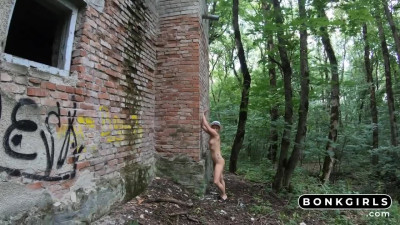Tattooed MILF with small tits and big ass goes wild in an abandoned forest