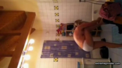 Spying on stepmom as she lotions her body