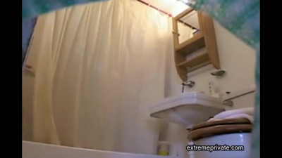 Black Stepsister bending in bathroom (spy cam)